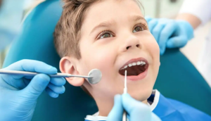 A child at a dental check-up, highlighting preventive dentistry's importance for oral health.