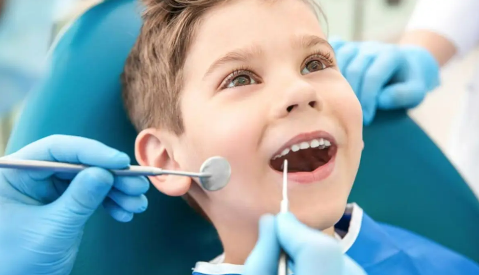 A child at a dental check-up, highlighting preventive dentistry's importance for oral health.